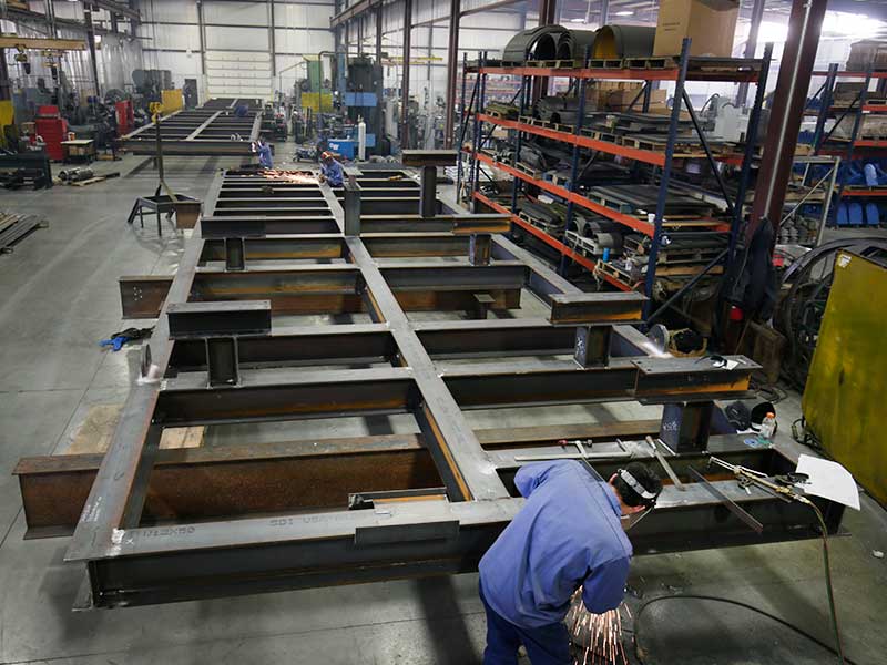 Fitting and welding skids in the fabrication shop