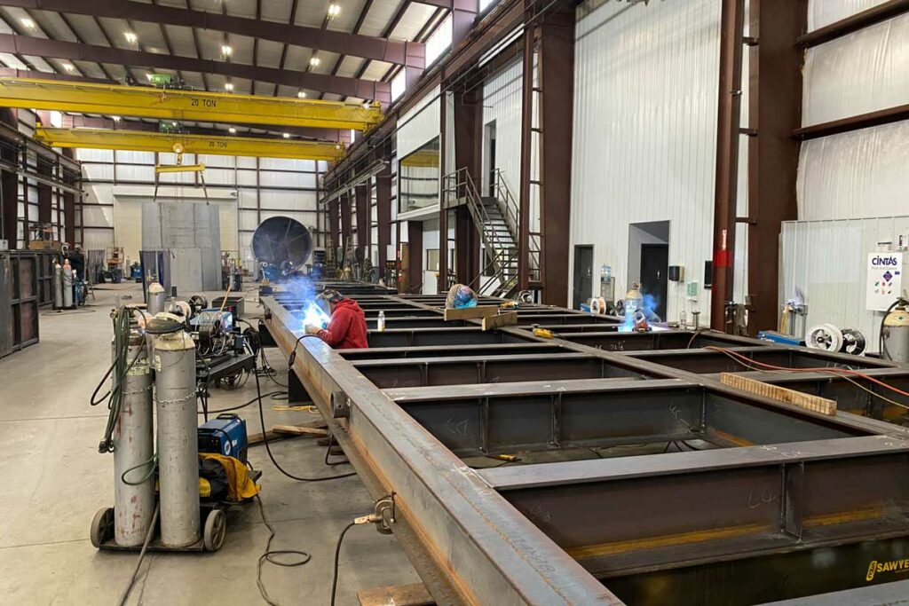 Welders working on a modular process skid